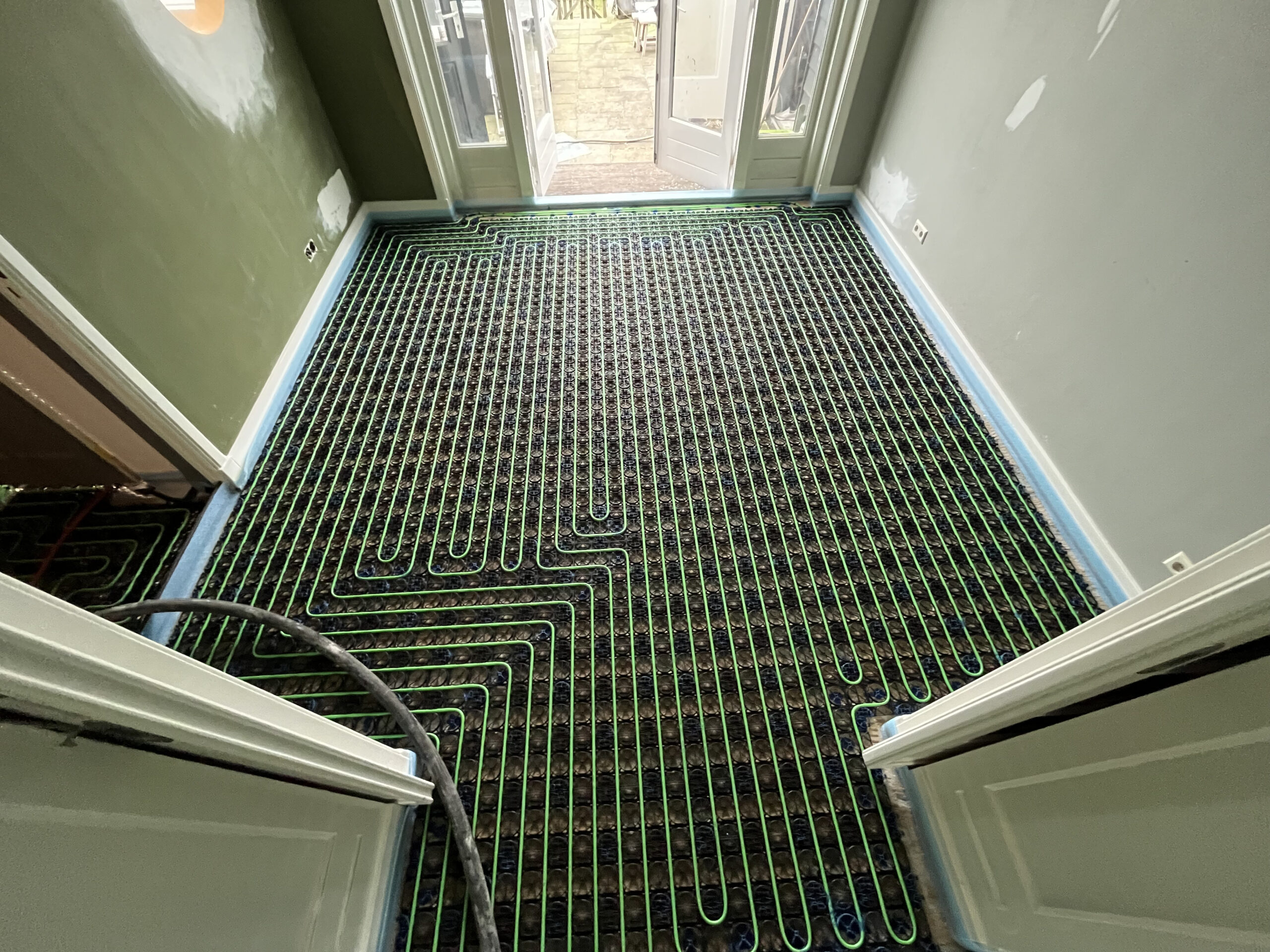 woonkamer openslaande deuren vloerverwarming