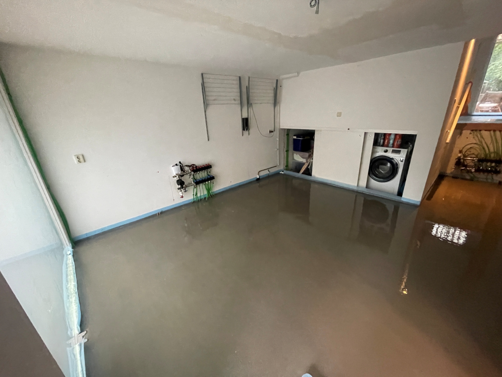 waskamer met vloerverwarming en vulmassa